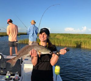 Lady caught large fish in the Marsh with Victory Bay Charters