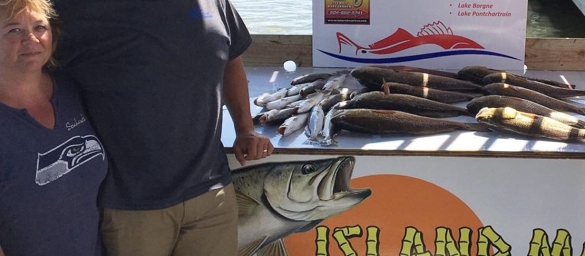 Fred and Lisa Redfish Charter fishing in Lake Catherine